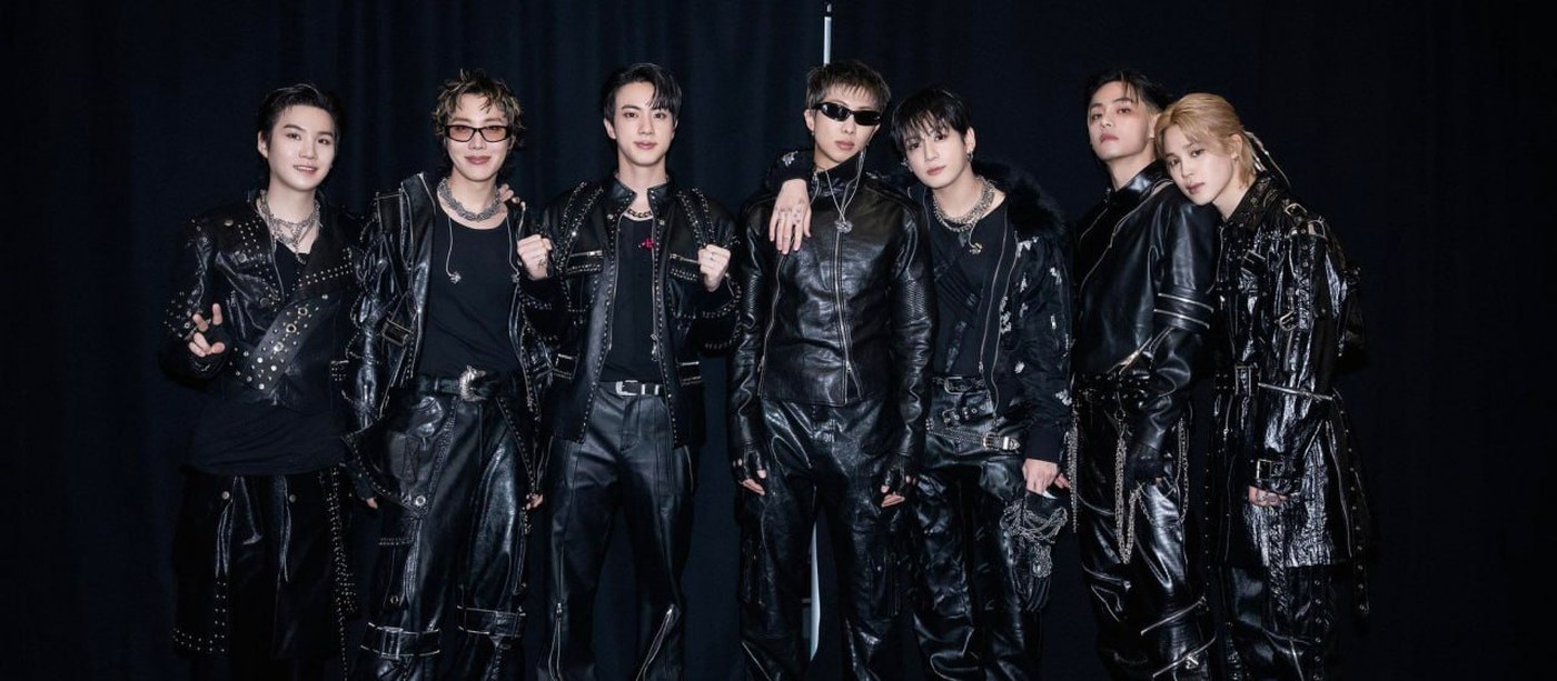 BTS VMAs 2026 winners: the seven members of BTS in black leather outfits, posing in a row against a black curtain