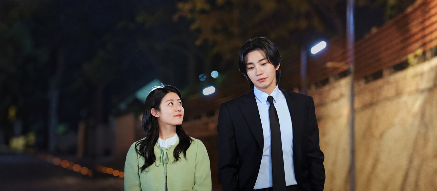 Make Me Tingle K-drama still: Nam Ji-hyun and Kim Jae-young walking side by side down a street at night